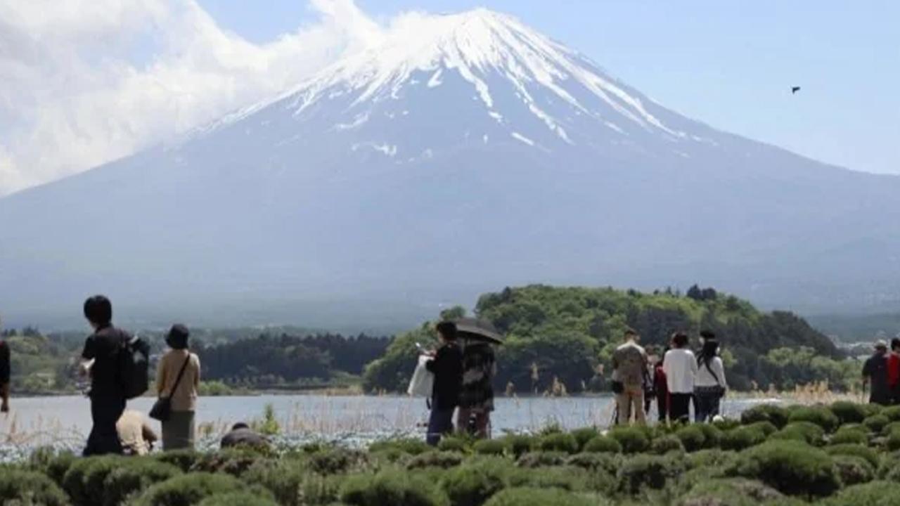 Mount Fuji climbers to face $13 fee starting July in Japan.