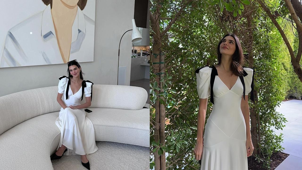 Kendall Jenner shines in white midi dress, embracing Bow Trend with style. Kendall Jenner shines in white midi dress, embracing Bow Trend with style.